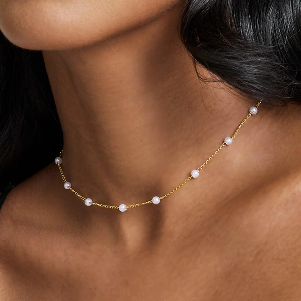 Gold Lover Girl pearl necklace worn as a choker
