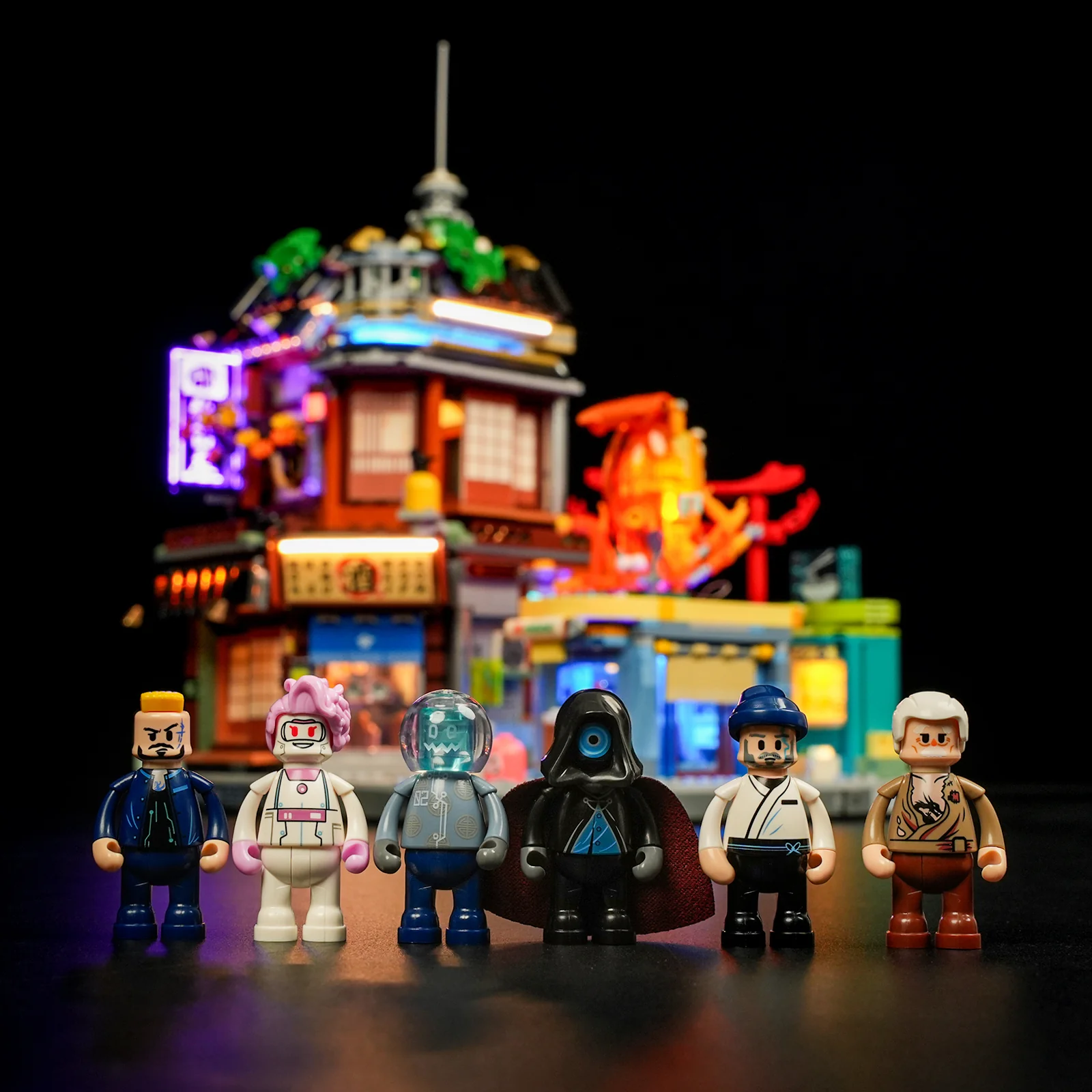 Six Lumibricks Izakaya minifigures lined up in front of the lit set