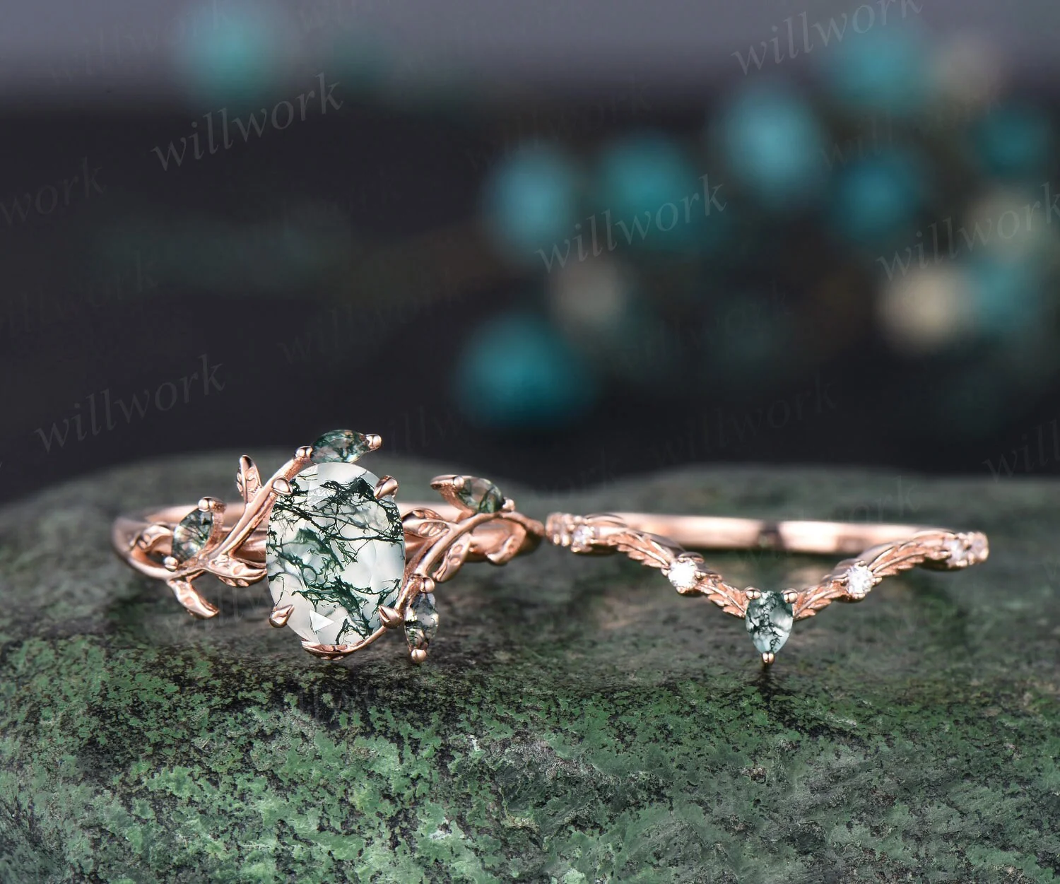 Oval moss agate ring and V-shaped leaf wedding band shown side by side