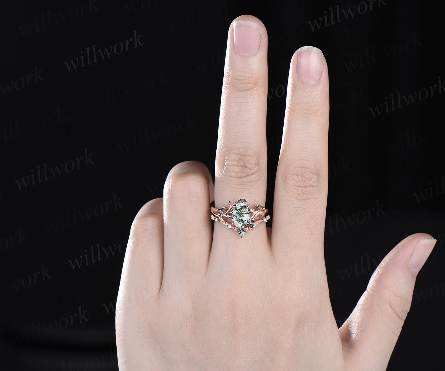 Model wearing the WillWork moss agate ring set in rose gold